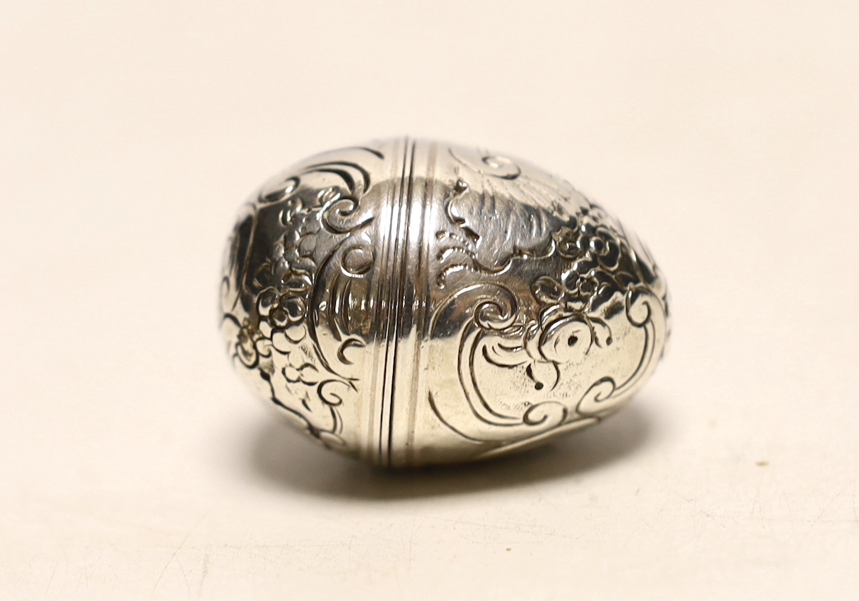 An engraved white metal egg shaped nutmeg grater, 40mm.